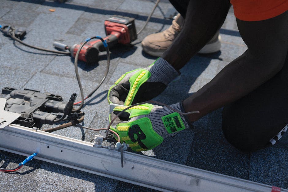 Solar panel installer working on a residential roof